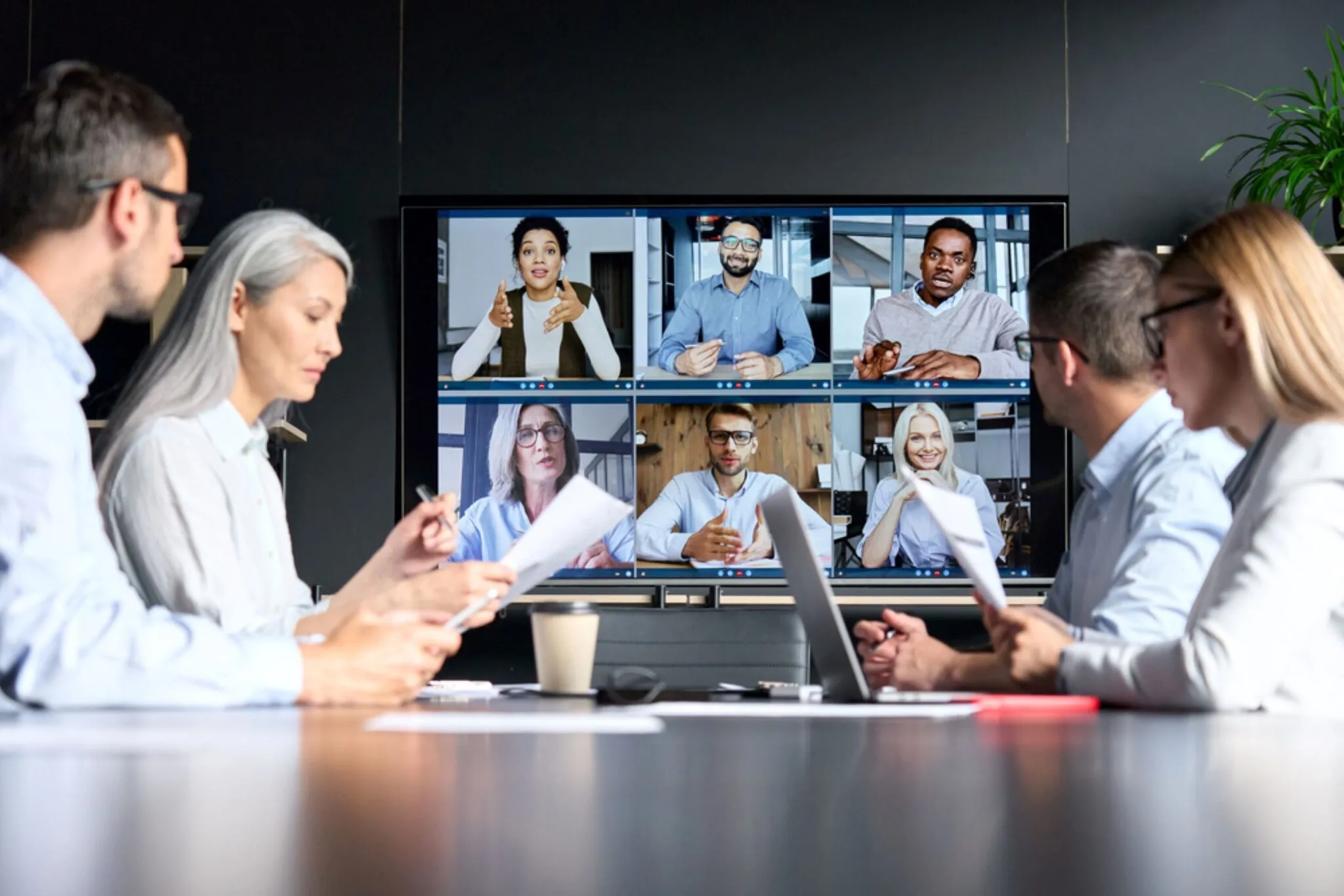 A hybrid project team working remotely and together